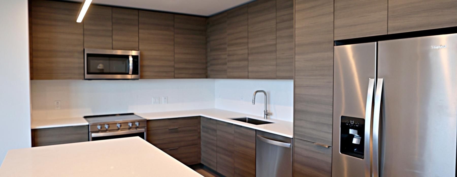 a kitchen with a refrigerator and a microwave